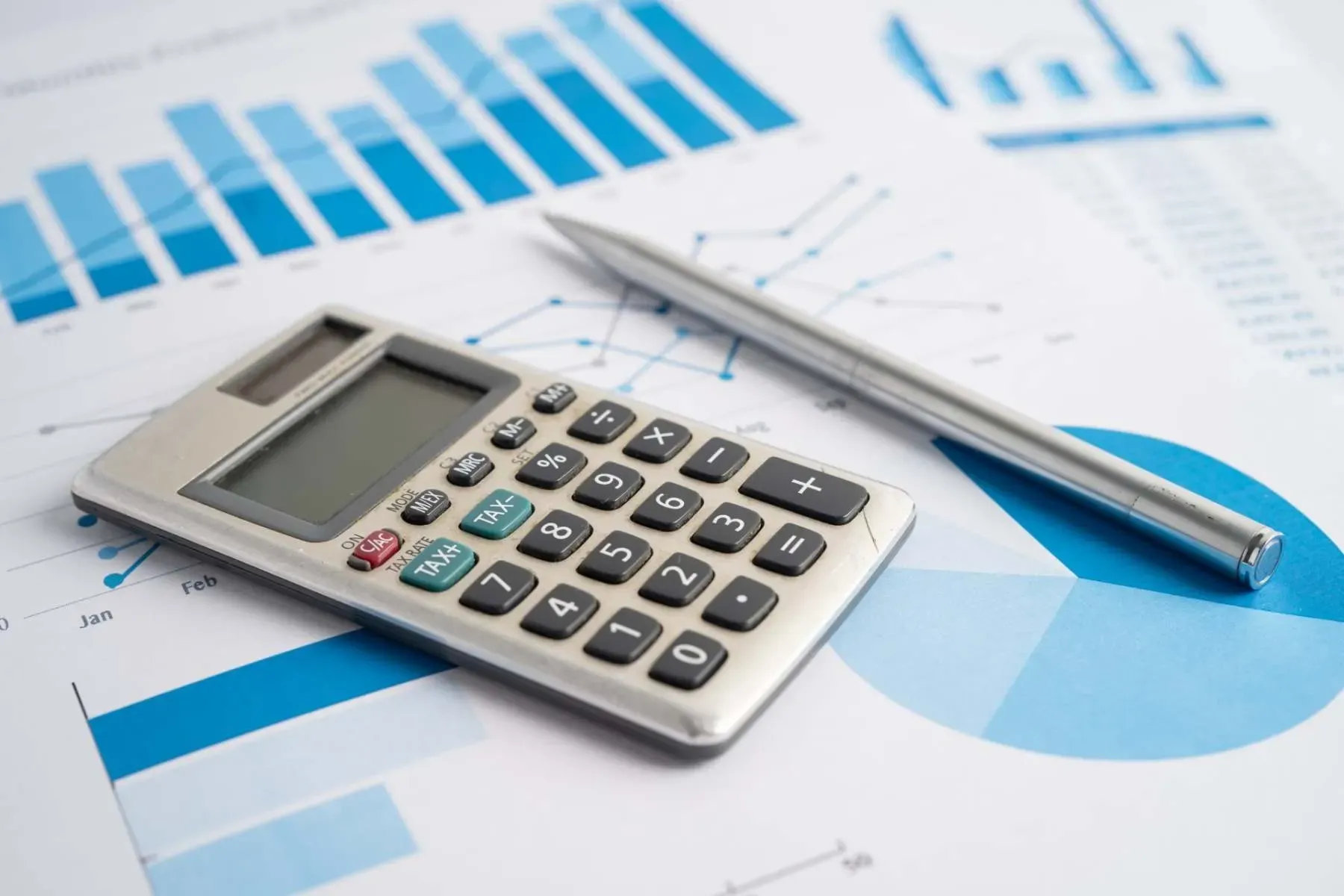 Calculator on a financial chart for payroll McGrath Pattison Accountants Northern Ireland