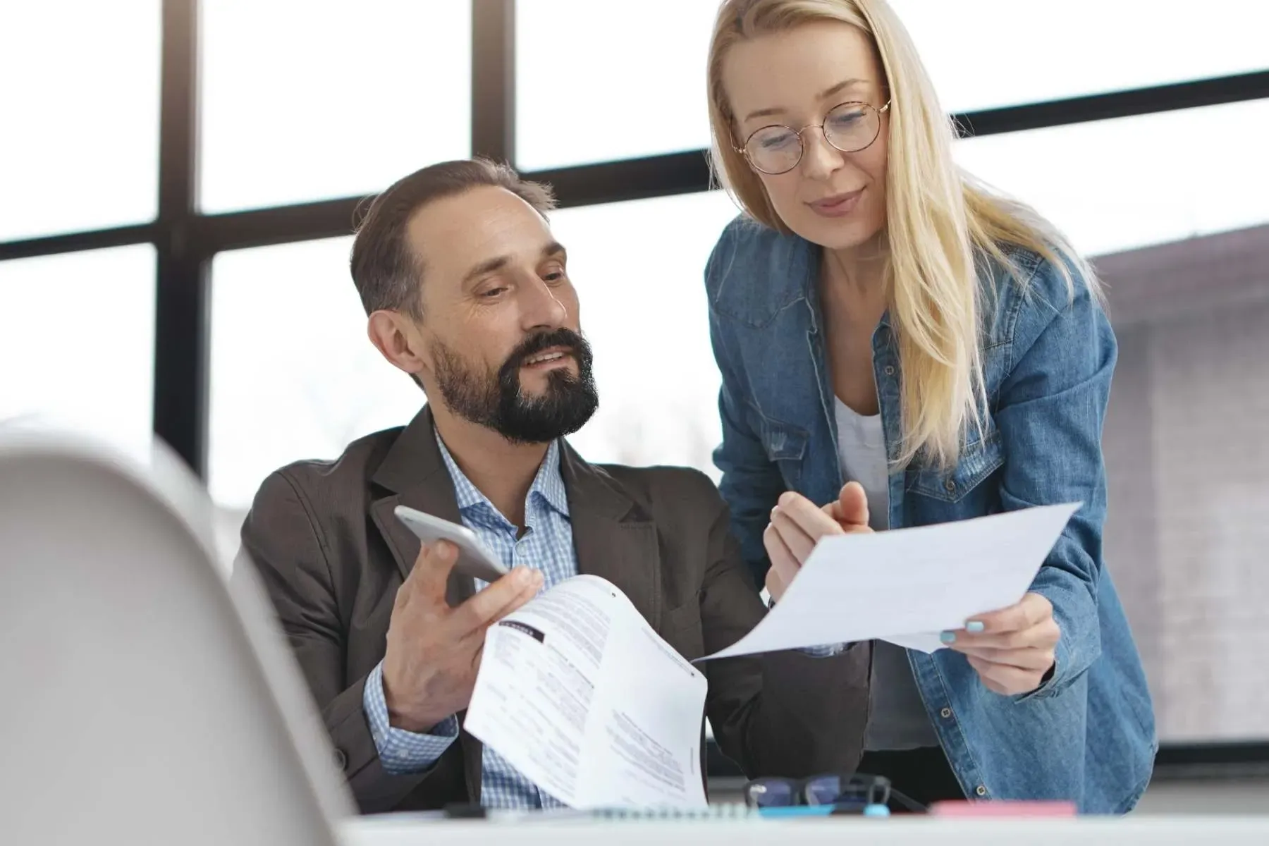 Experienced accountant reviewing tax paperwork McGrath Pattison Accountants Northern Ireland
